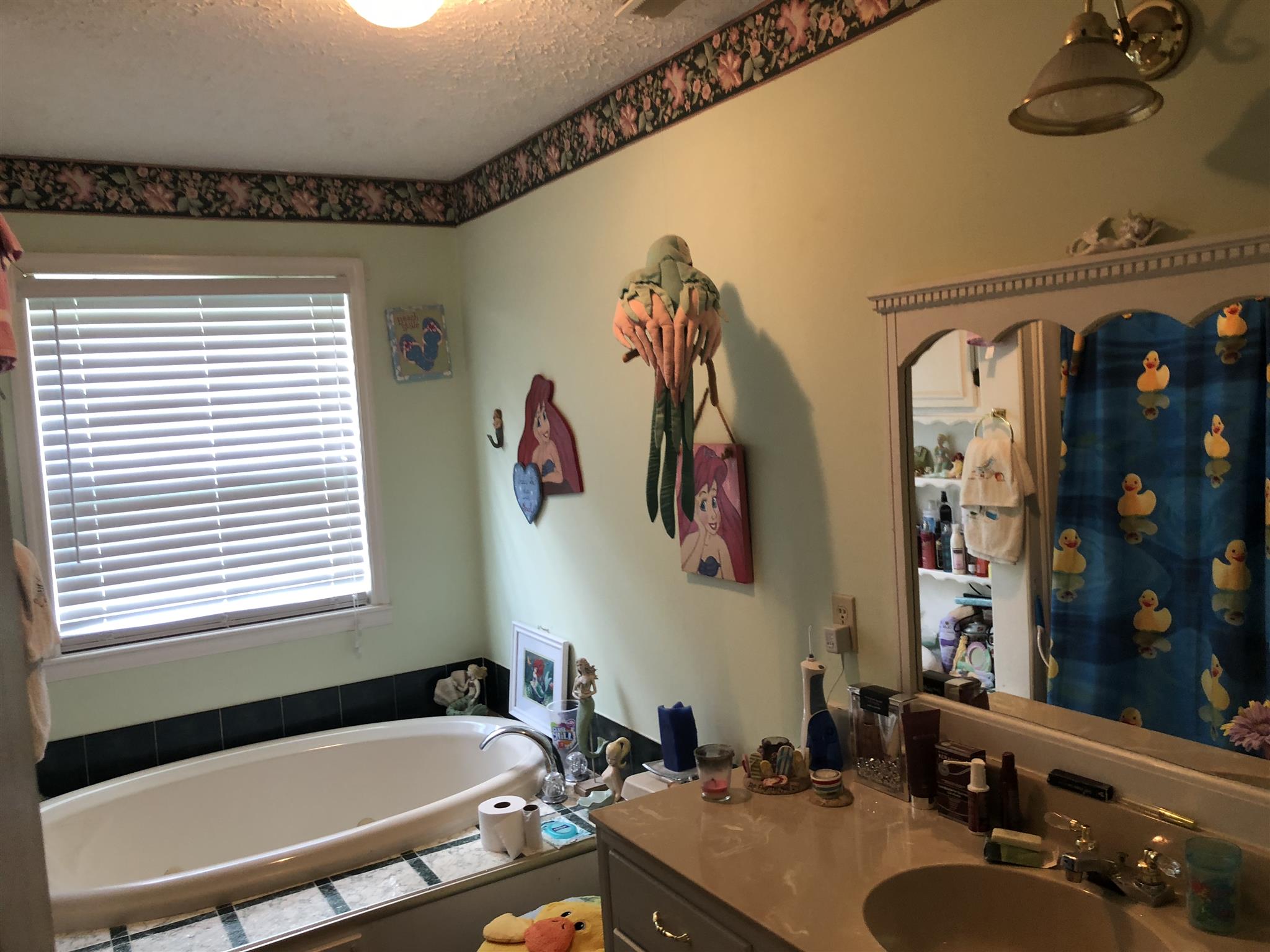 922 Harpo Road Manchester, TN 37355 - Photo 17 of 17 a bathroom with a tub sink and mirror
