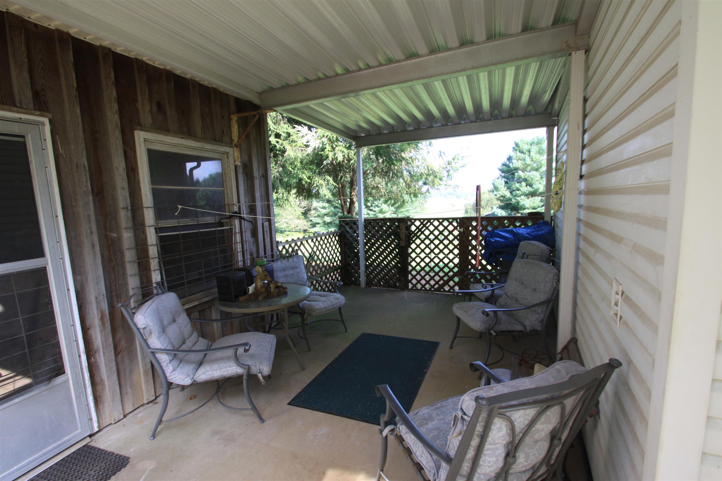 922 Harpo Road Manchester, TN 37355 - Photo 4 of 17 a view of two chairs in the balcony