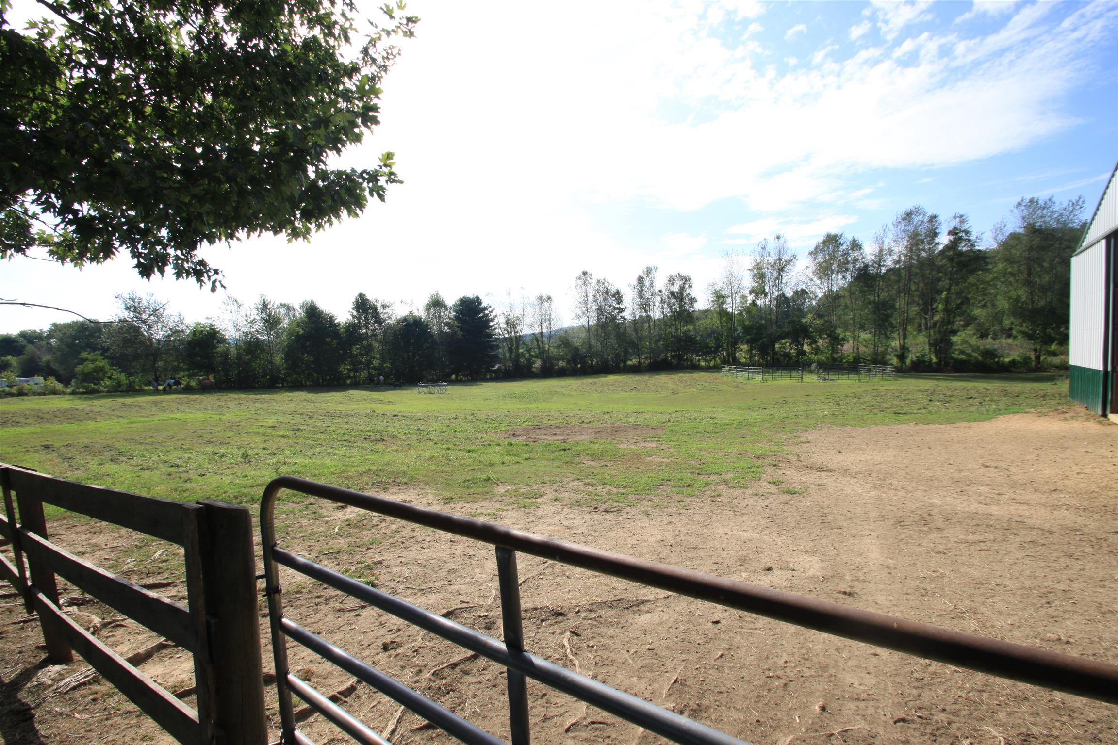 922 Harpo Road Manchester, TN 37355 - Photo 8 of 17 a view of a field with sitting space and a lake view