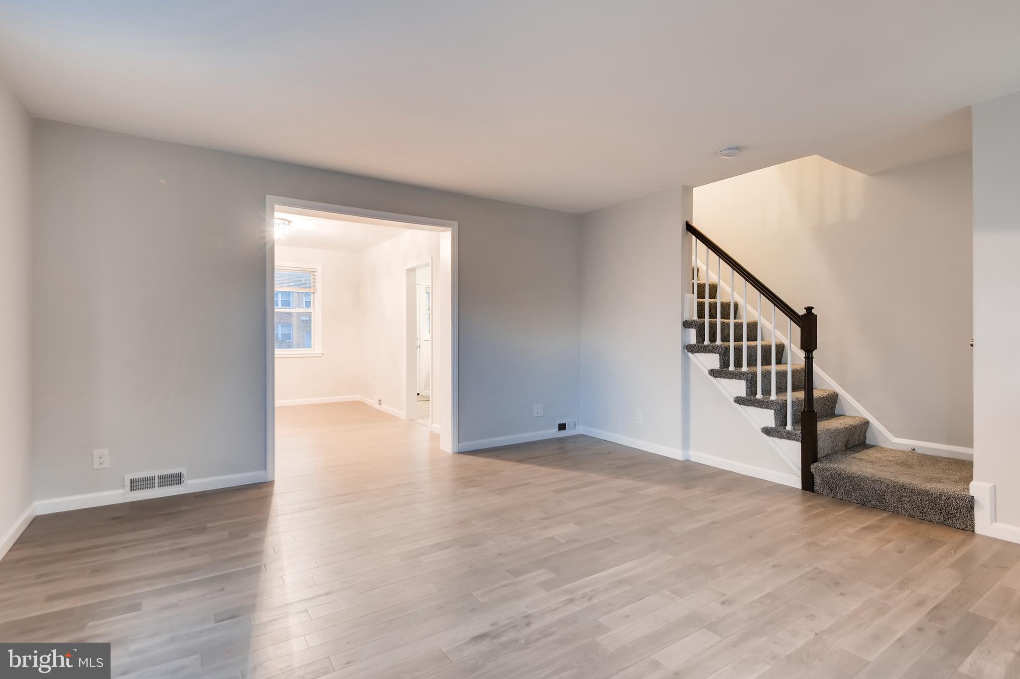 1615 Gleneagle Road Baltimore, MD 21239 - Photo 9 of 32 Living Room w/ updated flooring and new paint!