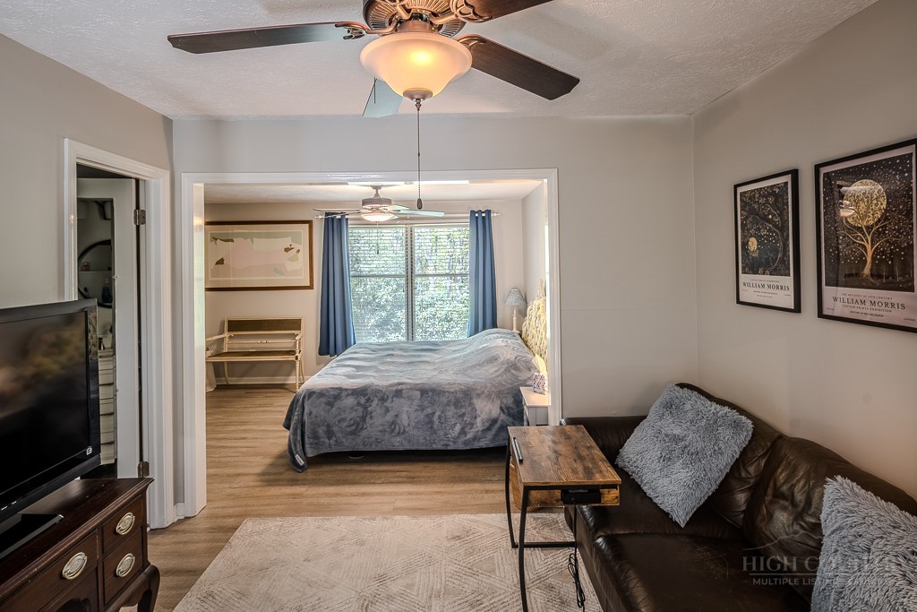 38 Rocky Meadows Road Newland, NC 28657 - Photo 18 of 50 a bedroom with a bed and a television