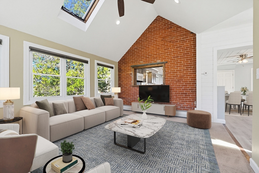 44 Clark Street Spencer, MA 01562 - Photo 6 of 41 a living room with furniture potted plant and a large window