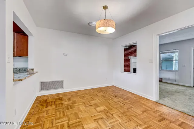 a view of a livingroom with wooden floor