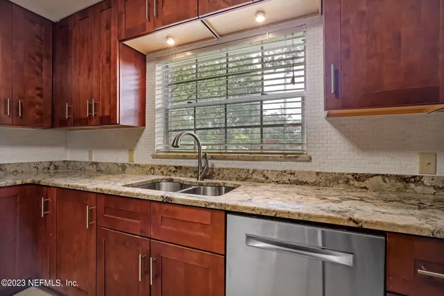 a kitchen with a sink and a window