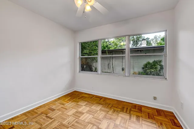 a view of an empty room with a window
