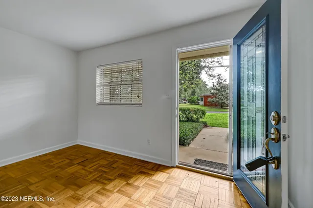 a view of a room with a bed