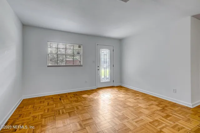 a view of empty room with windows