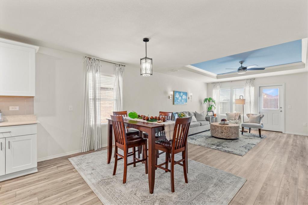 14056 Ilderton Street Pilot Point, TX 76258 - Photo 10 of 34 a view of a dining room with furniture