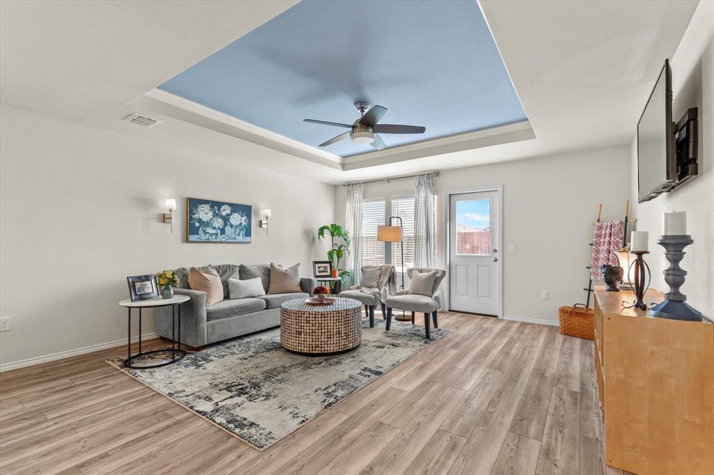 14056 Ilderton Street Pilot Point, TX 76258 - Photo 11 of 34 a living room with furniture and a wooden floor