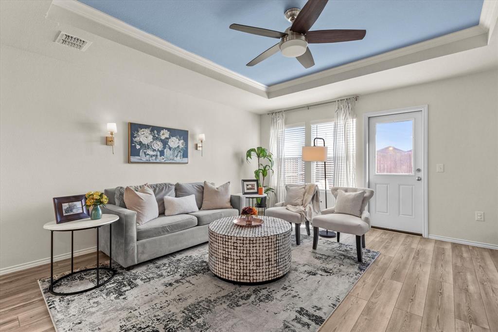 14056 Ilderton Street Pilot Point, TX 76258 - Photo 13 of 34 a living room with furniture and a wooden floor