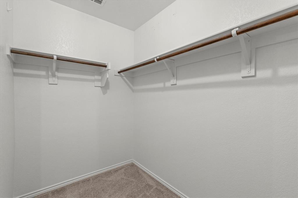 14056 Ilderton Street Pilot Point, TX 76258 - Photo 21 of 34 a view of an empty walk in closet