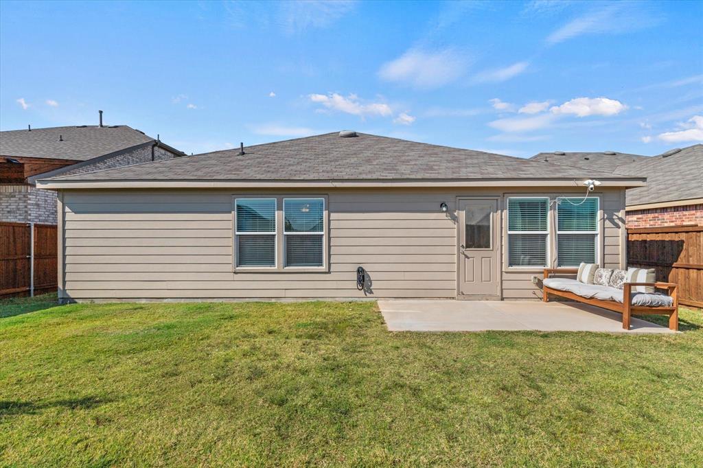 14056 Ilderton Street Pilot Point, TX 76258 - Photo 29 of 34 a front view of house with yard and seating area