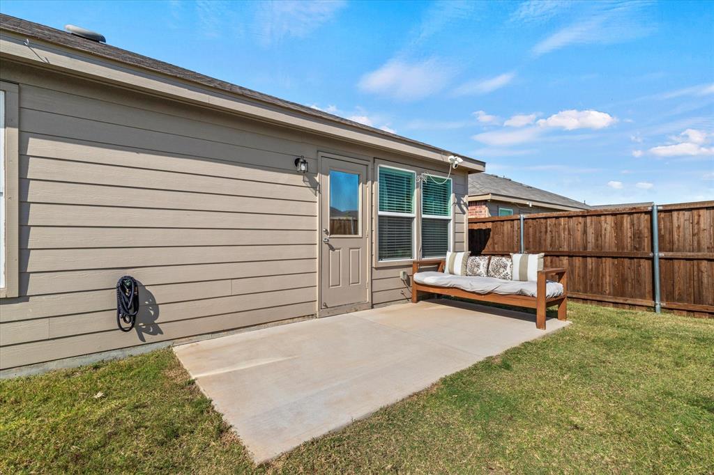 14056 Ilderton Street Pilot Point, TX 76258 - Photo 32 of 34 a backyard of a house with table and chairs