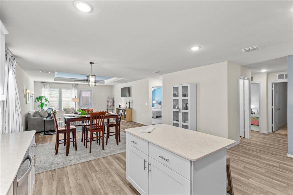 14056 Ilderton Street Pilot Point, TX 76258 - Photo 34 of 34 a view of a dining room with furniture and chandelier