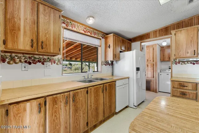 a bathroom with a sink a mirror and a shower