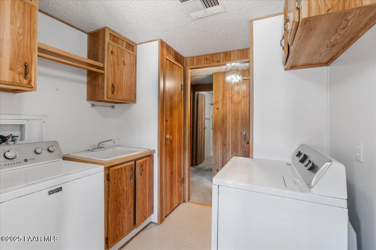 14012 Holly Road Mayer, AZ 86333 - Photo 13 of 28 a utility room with dryer and washer