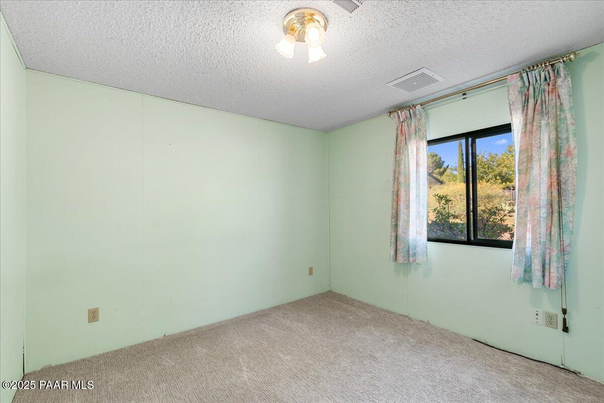 14012 Holly Road Mayer, AZ 86333 - Photo 17 of 28 an empty room with windows