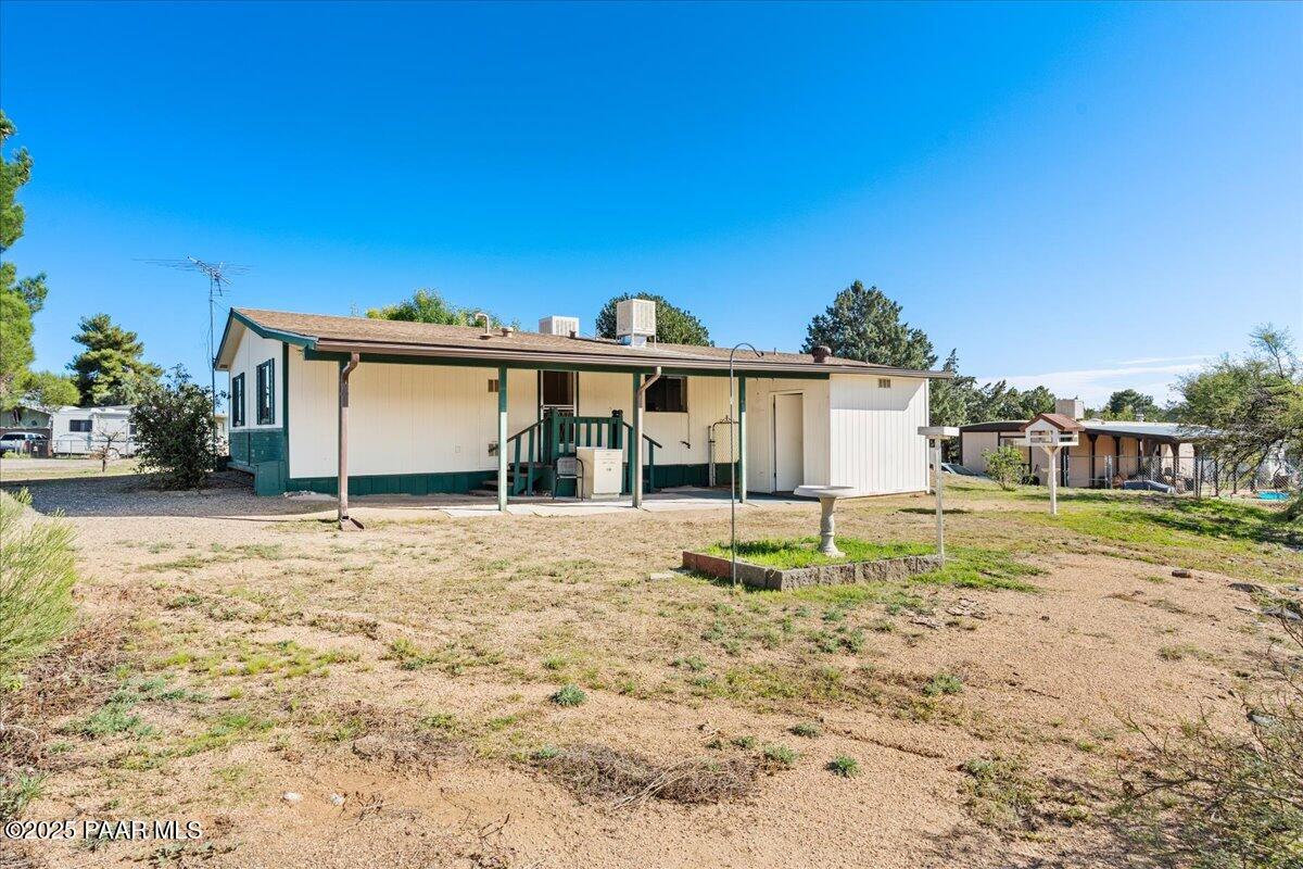 14012 Holly Road Mayer, AZ 86333 - Photo 25 of 28 a view of a house with a yard