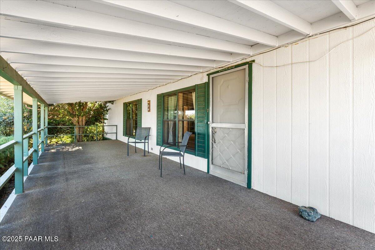 14012 Holly Road Mayer, AZ 86333 - Photo 3 of 28 a view of a room with floor to ceiling windows and yard