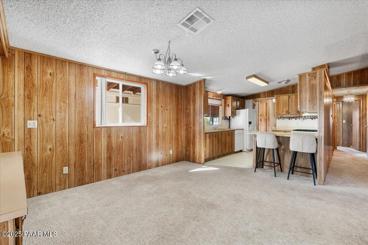 14012 Holly Road Mayer, AZ 86333 - Photo 8 of 28 a view of a livingroom with furniture cabinet and window