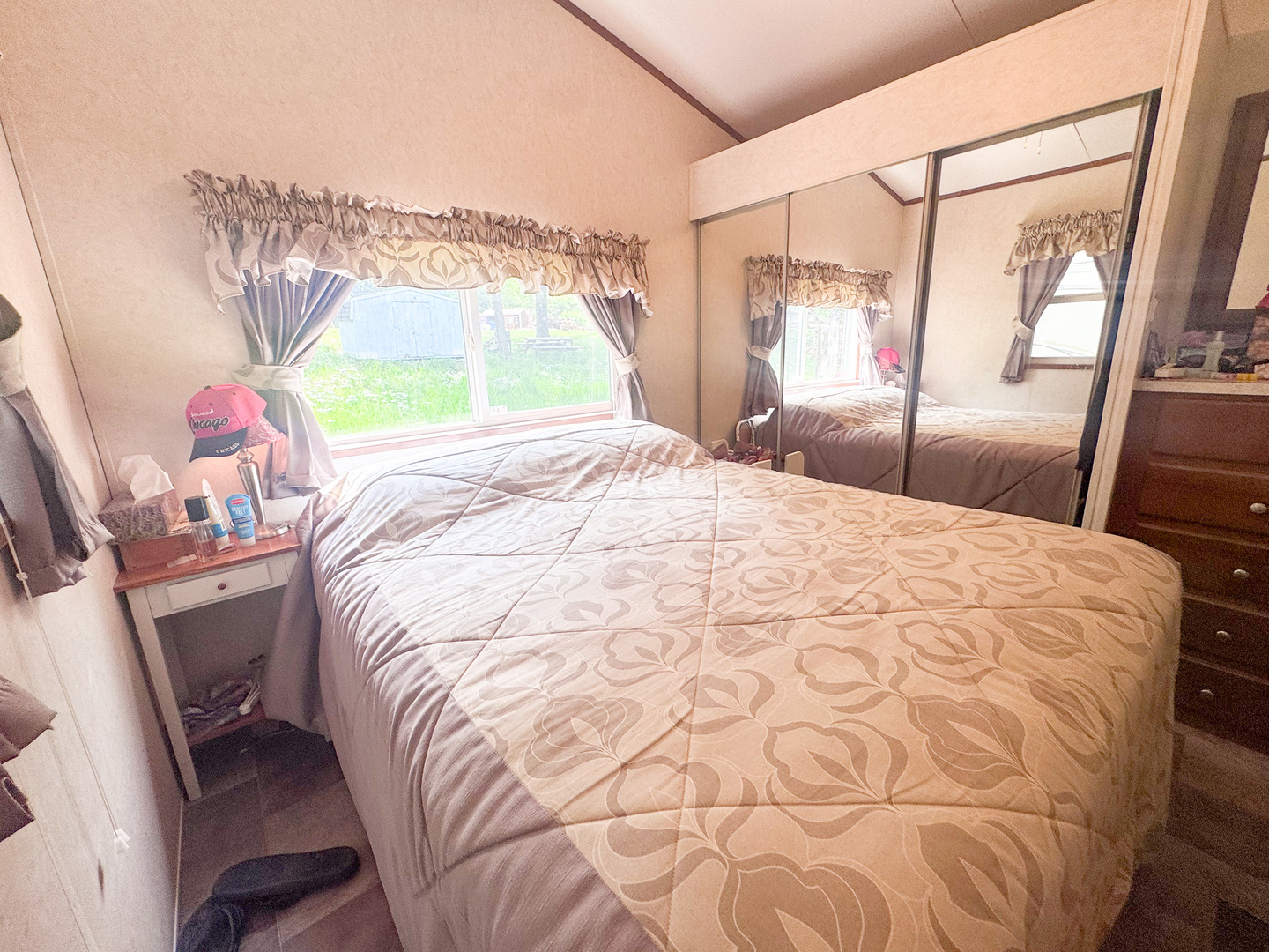 7-98 Woodhaven Sublette, IL 61367 - Photo 12 of 23 a bed sitting in a bedroom next to a window