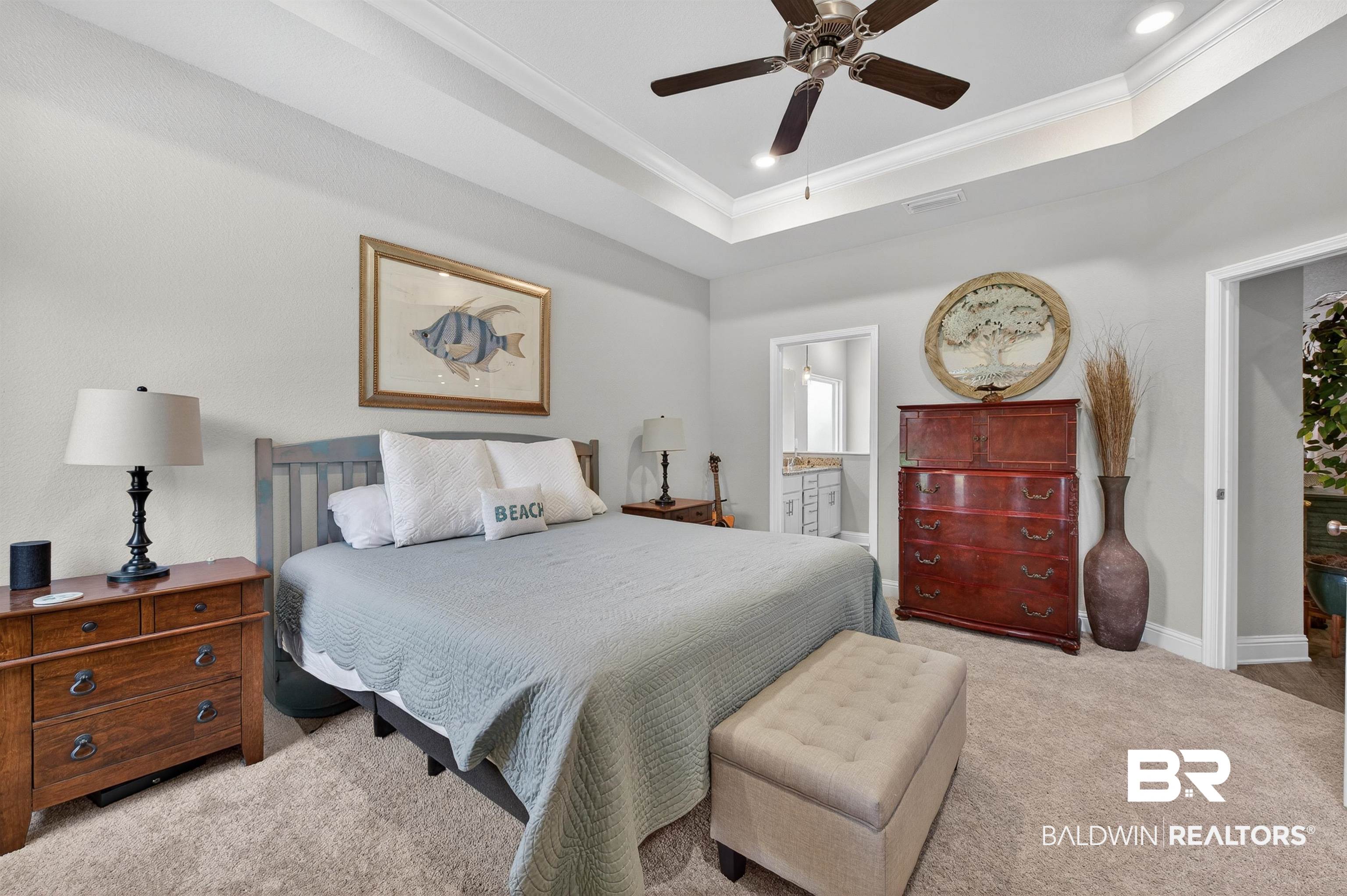 8735 Bronze Lane Foley, AL 36535 - Photo 22 of 58 Recessed lighting illuminates a tray ceiling with crown molding, complemented by a ceiling fan