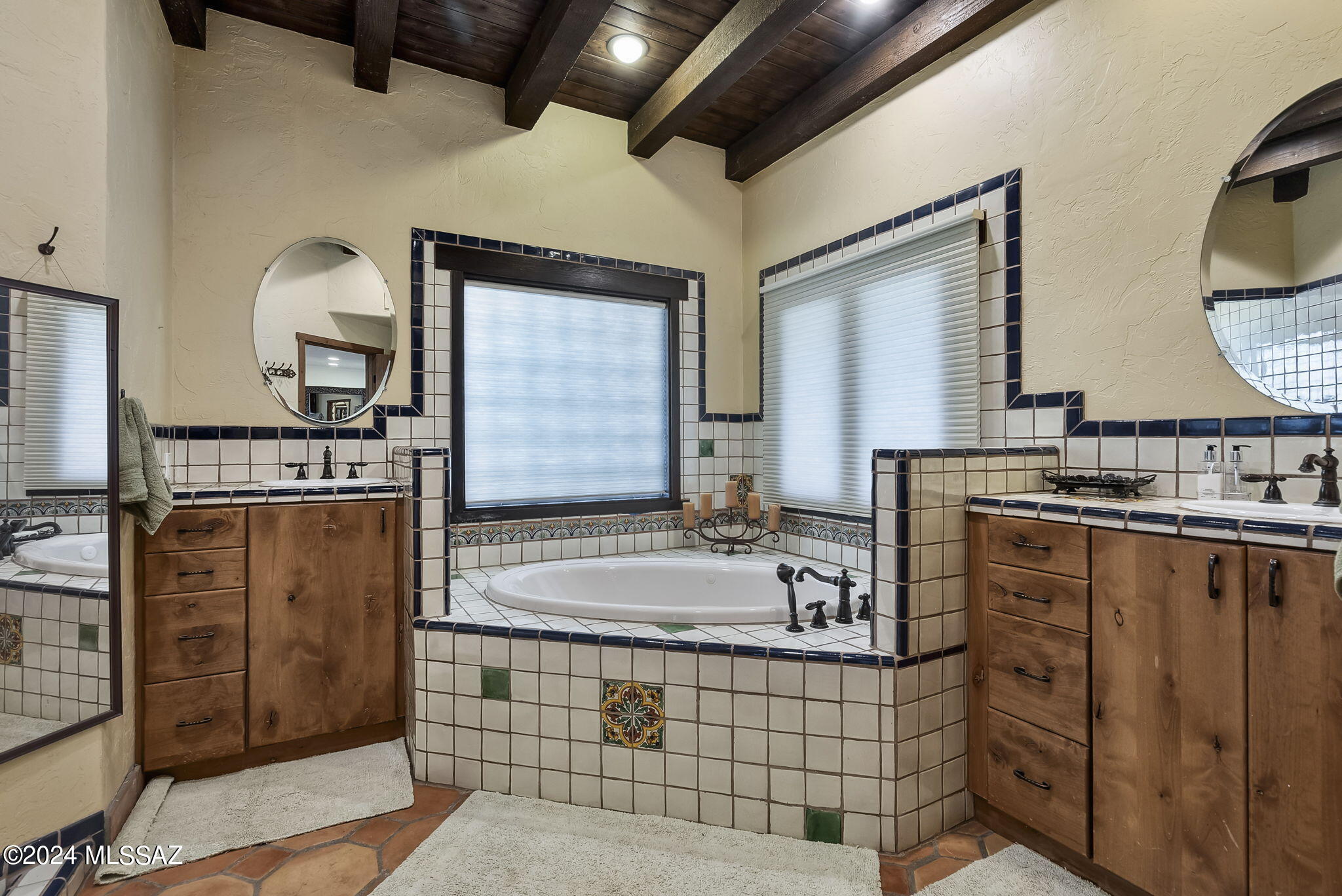 45 Clark Crossing Road Tumacacori, AZ 85640 - Photo 37 of 50 a bathroom with double vanity sink and a mirror
