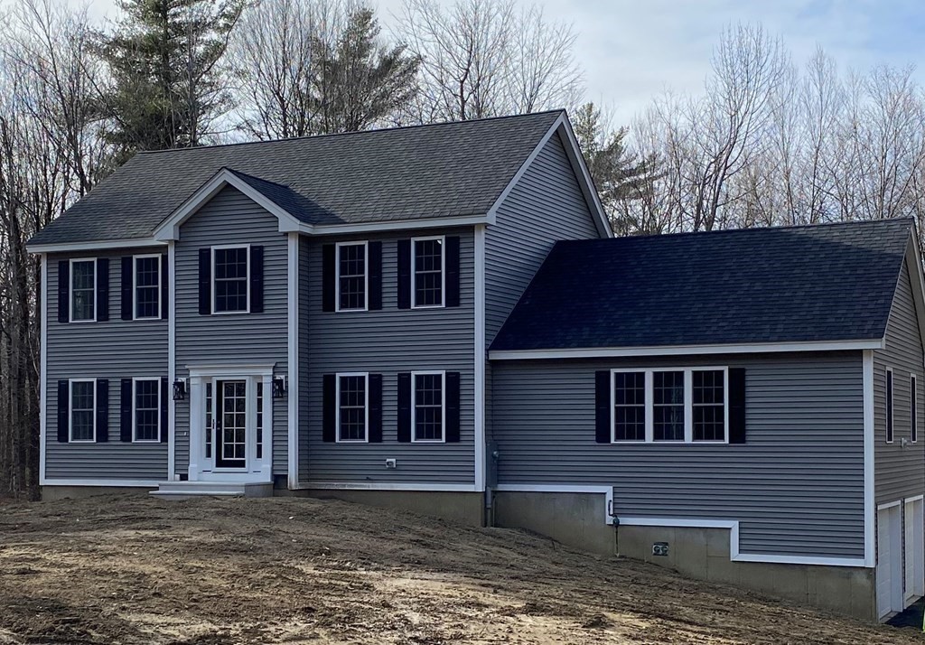 Lot 10 Glenwood Road Rutland, MA 01543 - Photo 1 of 39 a front view of a house with a garden