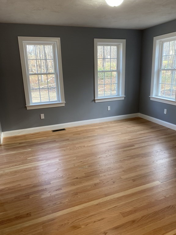 Lot 10 Glenwood Road Rutland, MA 01543 - Photo 11 of 39 an empty room with wooden floor and windows