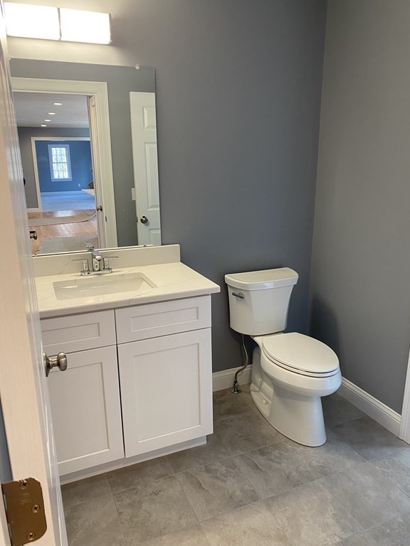 Lot 10 Glenwood Road Rutland, MA 01543 - Photo 13 of 39 a bathroom with a toilet sink and mirror