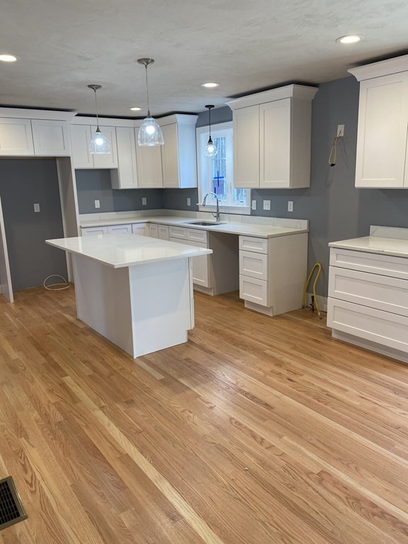 Lot 10 Glenwood Road Rutland, MA 01543 - Photo 3 of 39 a large kitchen with stainless steel appliances granite countertop a stove a sink and a refrigerator