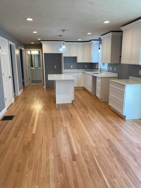Lot 10 Glenwood Road Rutland, MA 01543 - Photo 4 of 39 a large kitchen with stainless steel appliances a large counter top a stove and a refrigerator
