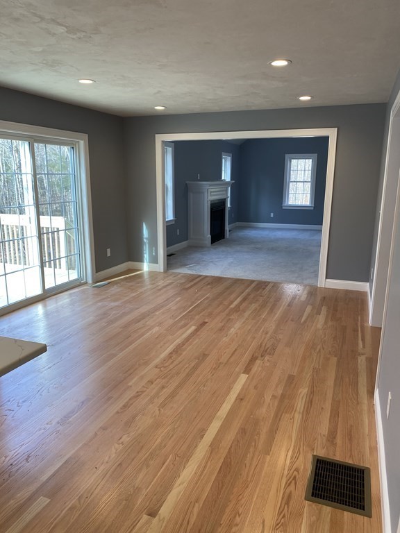 Lot 10 Glenwood Road Rutland, MA 01543 - Photo 5 of 39 a view of an empty room with a window and wooden floor