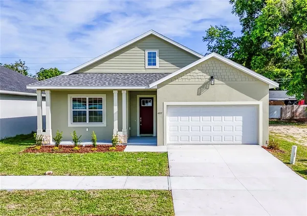 a front view of a house with a yard and porch