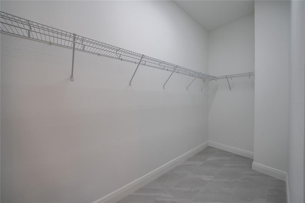 4727 Southeast 25th Loop Ocala, FL 34480 - Photo 16 of 29 a view of a room with racks on the wall