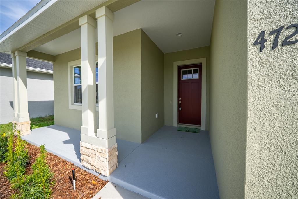 4727 Southeast 25th Loop Ocala, FL 34480 - Photo 2 of 29 a view of a porch with a floor to ceiling window