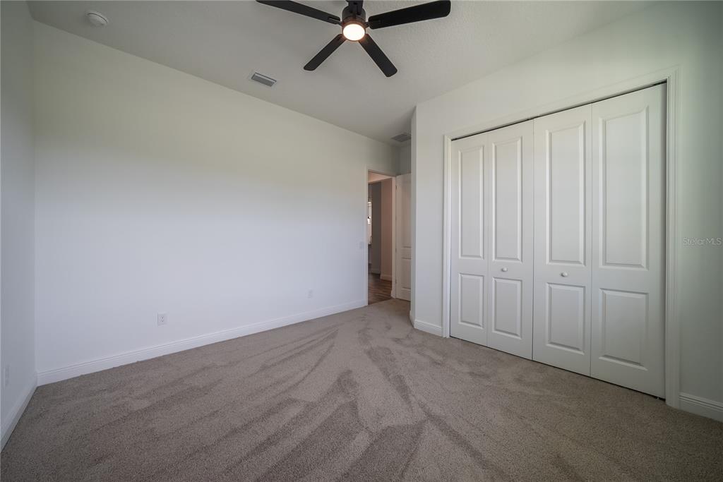 4727 Southeast 25th Loop Ocala, FL 34480 - Photo 22 of 29 wooden floor in an empty room