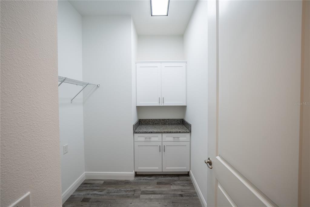 4727 Southeast 25th Loop Ocala, FL 34480 - Photo 23 of 29 a kitchen with a stove and a refrigerator