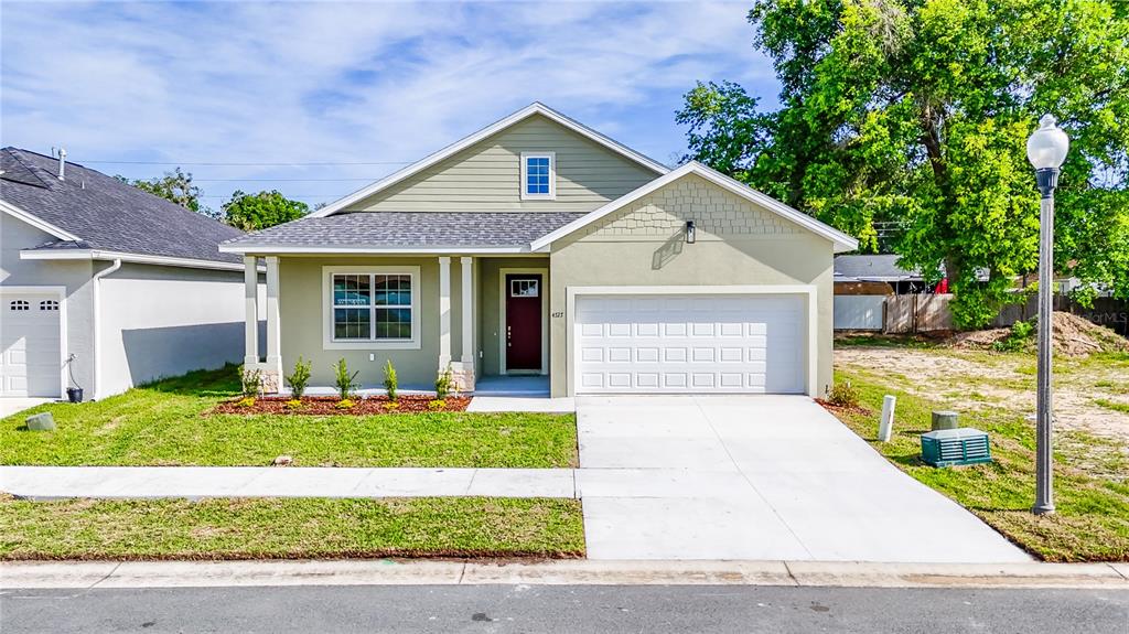 4727 Southeast 25th Loop Ocala, FL 34480 - Photo 29 of 29 a front view of a house with a yard