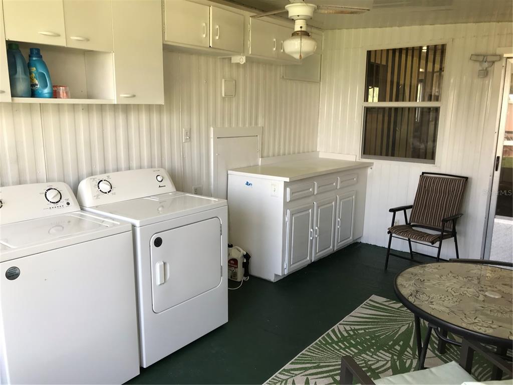 1091 Lemon Street Okeechobee, FL 34974 - Photo 11 of 19 a utility room with dryer and washer
