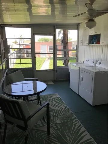 a kitchen with a table chairs and a stove