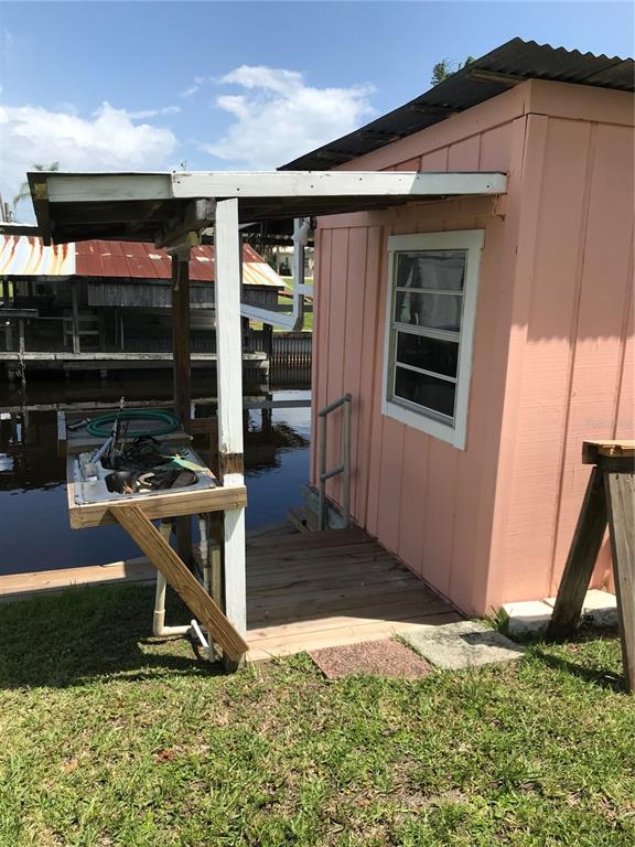 1091 Lemon Street Okeechobee, FL 34974 - Photo 16 of 19 a house view with a backyard space