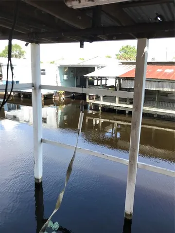 a view of a patio with wooden floor