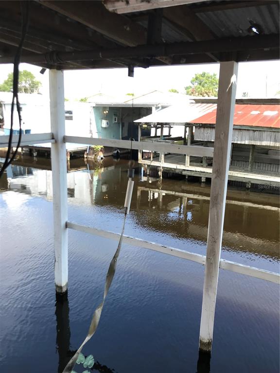 1091 Lemon Street Okeechobee, FL 34974 - Photo 18 of 19 a view of a patio with wooden floor