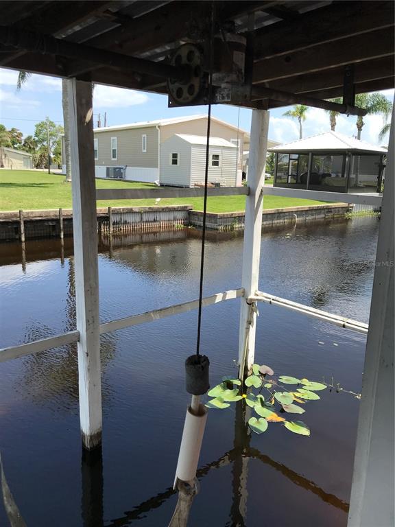 1091 Lemon Street Okeechobee, FL 34974 - Photo 19 of 19 a porch with a table and chairs
