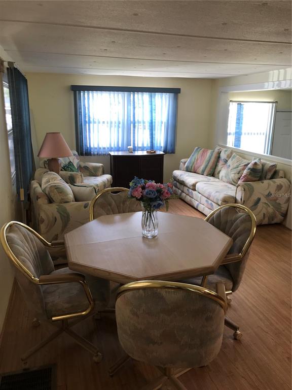 1091 Lemon Street Okeechobee, FL 34974 - Photo 4 of 19 a living room with furniture and a window