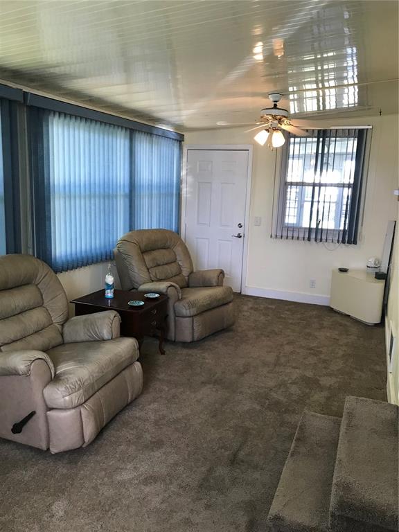 1091 Lemon Street Okeechobee, FL 34974 - Photo 5 of 19 a living room with furniture and a window