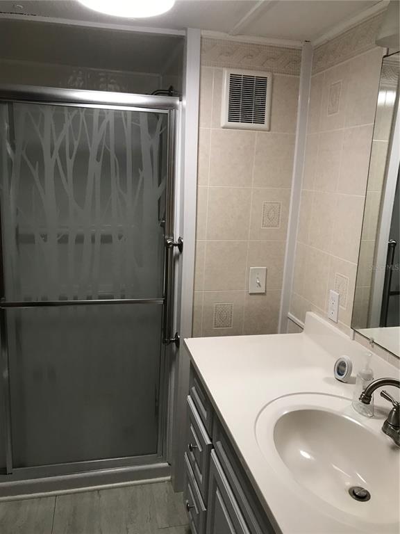 1091 Lemon Street Okeechobee, FL 34974 - Photo 10 of 19 a bathroom with a sink and a mirror