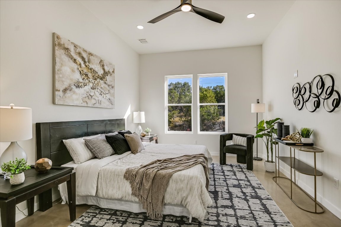 54 War Bonnet Wimberley, TX 78676 - Photo 16 of 32 a bedroom with a bed and a table