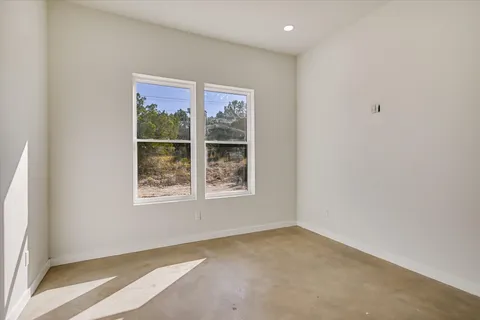 a bathroom with a shower sink and mirror